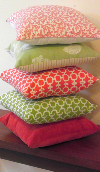 stack of pillows in lime and tangerine colors